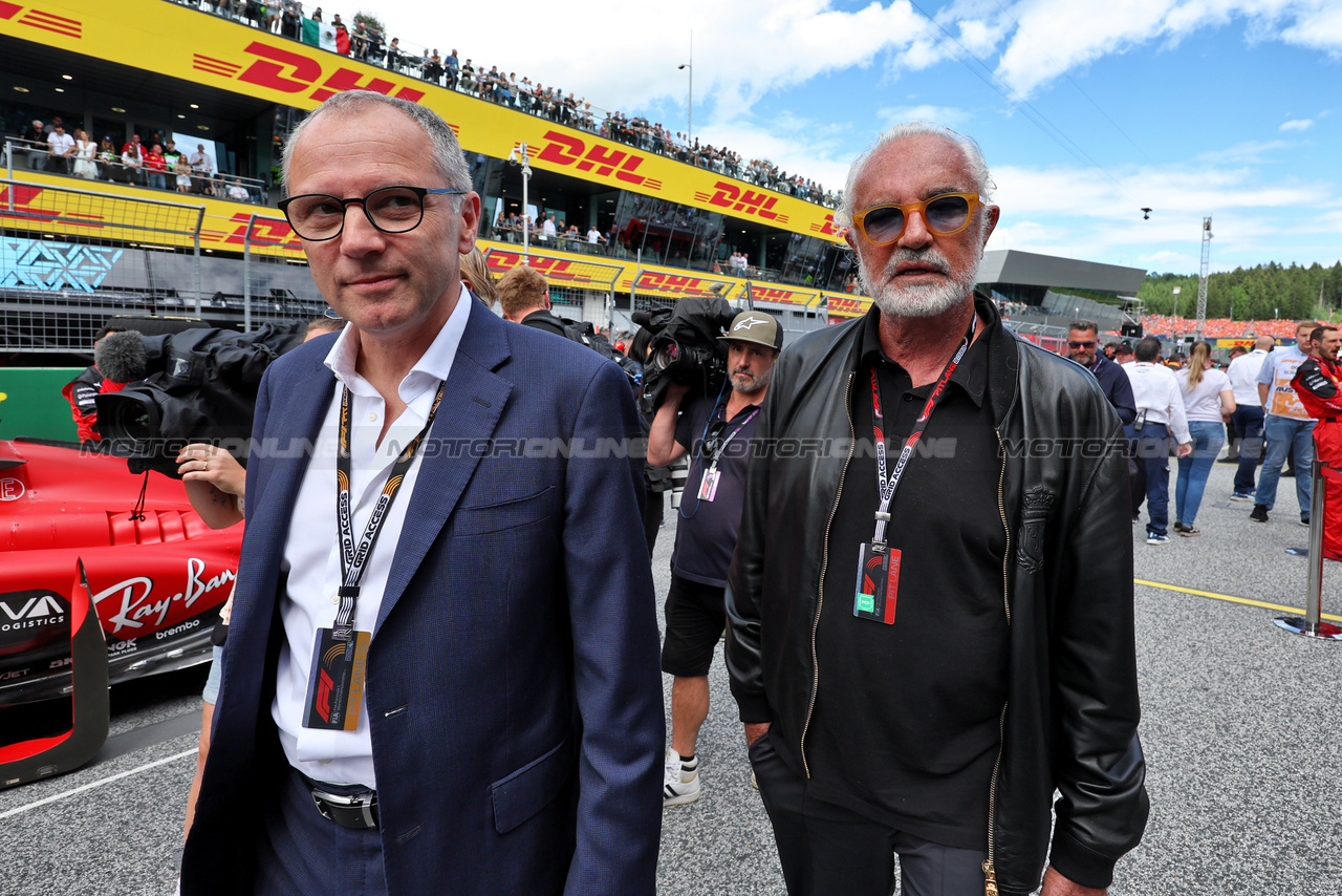 GP AUSTRIA, (L to R): Stefano Domenicali (ITA) Formula One President e CEO with Flavio Briatore (ITA) on the grid.

02.07.2023. Formula 1 World Championship, Rd 10, Austrian Grand Prix, Spielberg, Austria, Gara Day.

- www.xpbimages.com, EMail: requests@xpbimages.com © Copyright: Moy / XPB Images