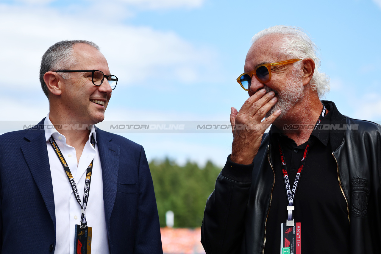 GP AUSTRIA, (L to R): Stefano Domenicali (ITA) Formula One President e CEO with Flavio Briatore (ITA) og.

02.07.2023. Formula 1 World Championship, Rd 10, Austrian Grand Prix, Spielberg, Austria, Gara Day.

- www.xpbimages.com, EMail: requests@xpbimages.com © Copyright: Batchelor / XPB Images