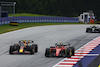 GP AUSTRIA, (L to R): Sergio Perez (MEX) Red Bull Racing RB19 e Carlos Sainz Jr (ESP) Ferrari SF-23 battle for position.
02.07.2023. Formula 1 World Championship, Rd 10, Austrian Grand Prix, Spielberg, Austria, Gara Day.
 - www.xpbimages.com, EMail: requests@xpbimages.com © Copyright: Coates / XPB Images