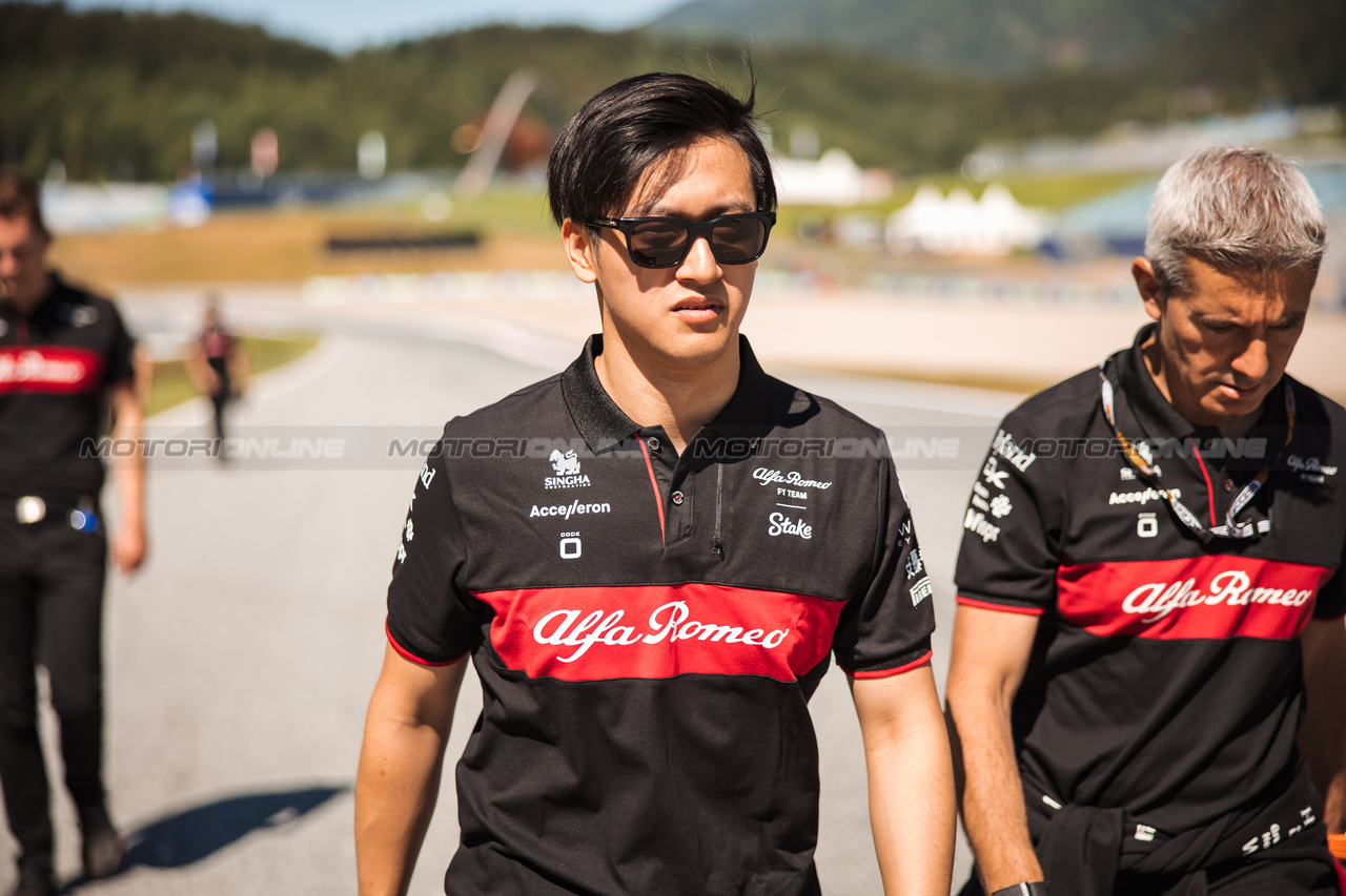 GP AUSTRIA, Zhou Guanyu (CHN) Alfa Romeo F1 Team walks the circuit with the team.

29.06.2023. Formula 1 World Championship, Rd 10, Austrian Grand Prix, Spielberg, Austria, Preparation Day.

- www.xpbimages.com, EMail: requests@xpbimages.com © Copyright: Bearne / XPB Images