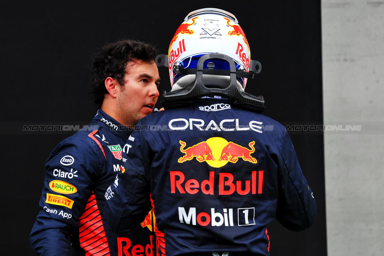 GP AUSTRIA, (L to R): Sergio Perez (MEX) Red Bull Racing with team mate Max Verstappen (NLD) Red Bull Racing in parc ferme.

01.07.2023. Formula 1 World Championship, Rd 10, Austrian Grand Prix, Spielberg, Austria, Sprint Day.

- www.xpbimages.com, EMail: requests@xpbimages.com © Copyright: Batchelor / XPB Images