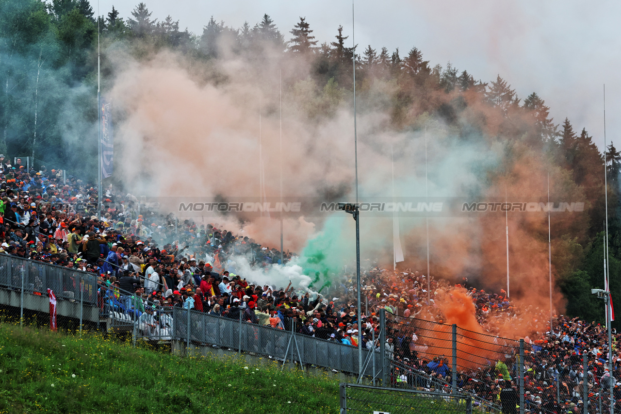 GP AUSTRIA, Circuit Atmosfera - fans with flares in the grandstand.

01.07.2023. Formula 1 World Championship, Rd 10, Austrian Grand Prix, Spielberg, Austria, Sprint Day.

- www.xpbimages.com, EMail: requests@xpbimages.com © Copyright: Moy / XPB Images