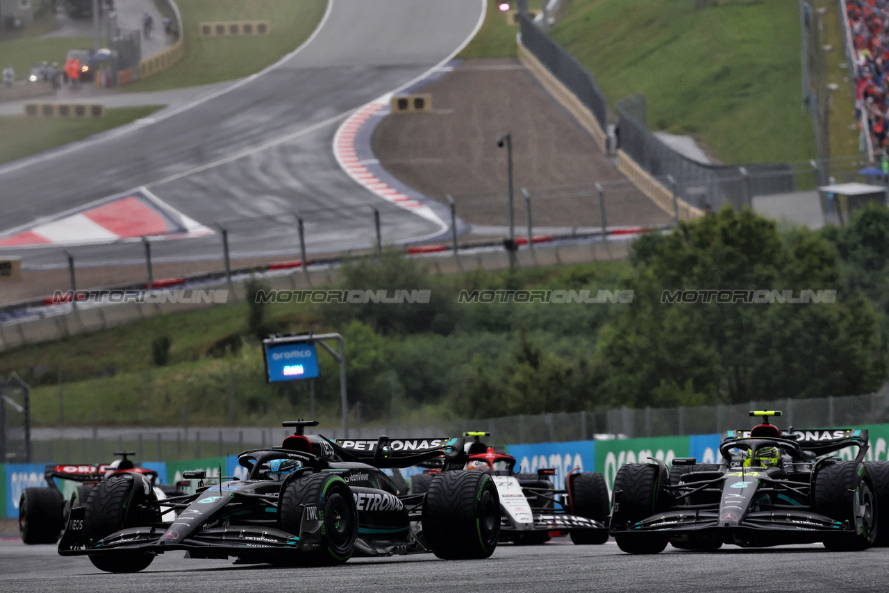 GP AUSTRIA, George Russell (GBR) Mercedes AMG F1 W14 e Lewis Hamilton (GBR) Mercedes AMG F1 W14 battle for position.

01.07.2023. Formula 1 World Championship, Rd 10, Austrian Grand Prix, Spielberg, Austria, Sprint Day.

 - www.xpbimages.com, EMail: requests@xpbimages.com © Copyright: Coates / XPB Images