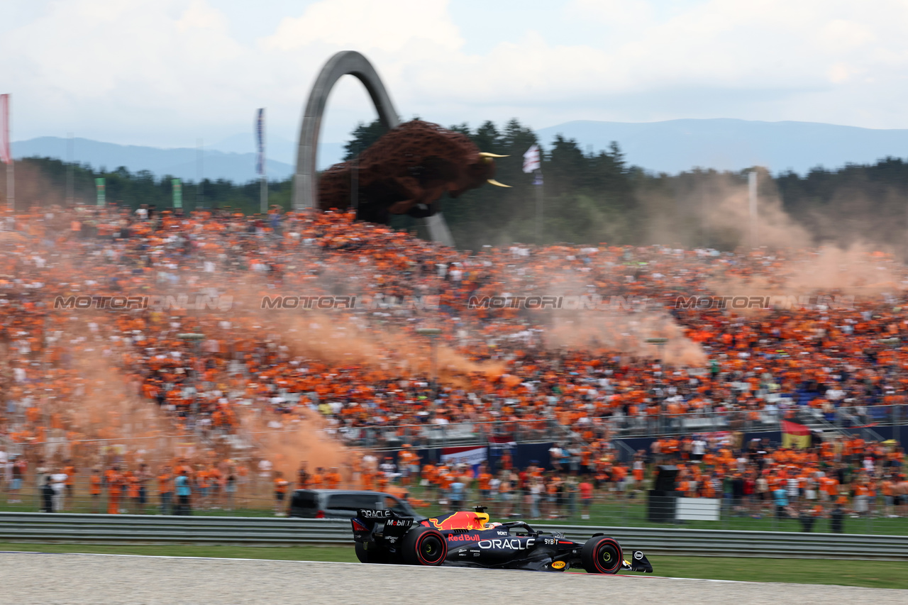 GP AUSTRIA, Max Verstappen (NLD) Red Bull Racing RB19 passes fans in the grandstand with flares being set off.

30.06.2023. Formula 1 World Championship, Rd 10, Austrian Grand Prix, Spielberg, Austria, Qualifiche Day.

- www.xpbimages.com, EMail: requests@xpbimages.com © Copyright: Moy / XPB Images