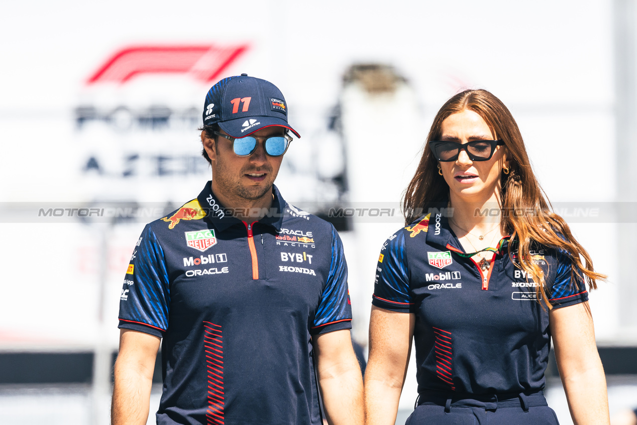 GP AZERBAIJAN, (L to R): Sergio Perez (MEX) Red Bull Racing with Alice Hedworth (GBR) Red Bull Racing Communications Manager.

27.04.2023. Formula 1 World Championship, Rd 4, Azerbaijan Grand Prix, Baku Street Circuit, Azerbaijan, Preparation Day.

- www.xpbimages.com, EMail: requests@xpbimages.com ¬© Copyright: Bearne / XPB Images