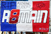 GP BAHRAIN, Circuit Atmosfera - a fans' french flag with references to Anthoine Hubert, Jules Bianchi, e Romain Grosjean.
04.03.2023. Formula 1 World Championship, Rd 1, Bahrain Grand Prix, Sakhir, Bahrain, Qualifiche Day.
 - www.xpbimages.com, EMail: requests@xpbimages.com © Copyright: Coates / XPB Images