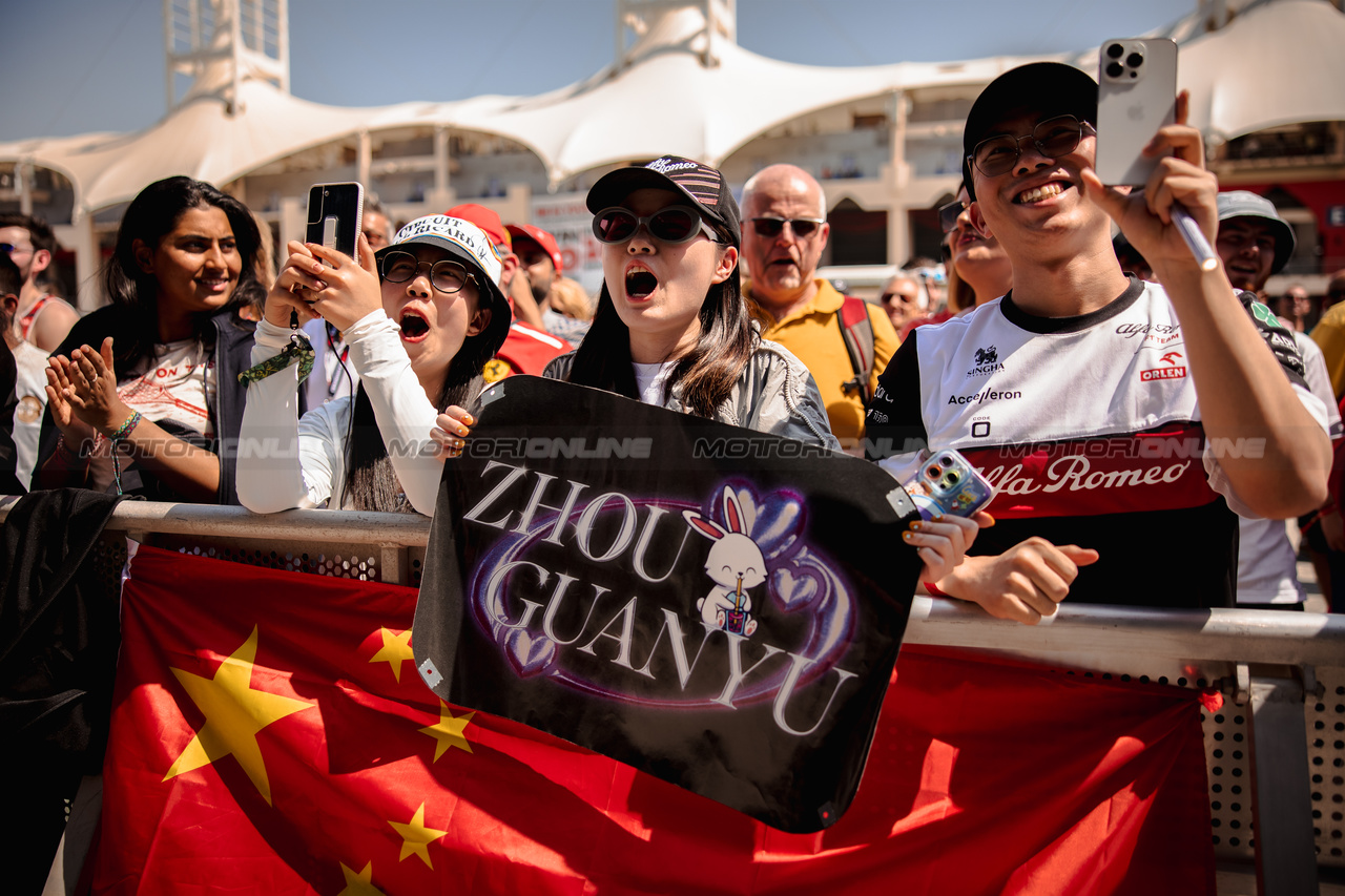 GP BAHRAIN, Zhou Guanyu (CHN) Alfa Romeo F1 Team fans at the FanZone Stage.

03.03.2023. Formula 1 World Championship, Rd 1, Bahrain Grand Prix, Sakhir, Bahrain, Practice Day

- www.xpbimages.com, EMail: requests@xpbimages.com © Copyright: Bearne / XPB Images
