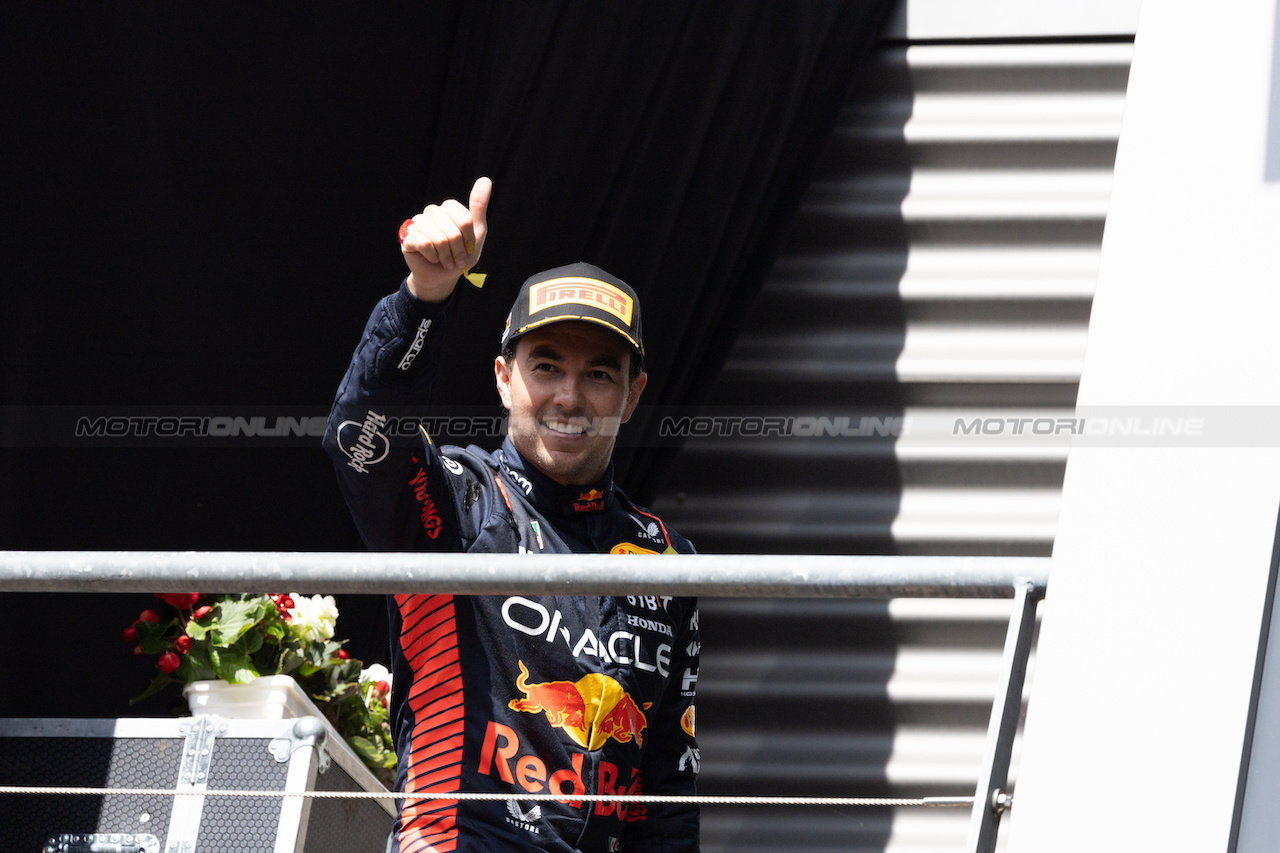 GP BELGIO, Sergio Perez (MEX) Red Bull Racing celebrates his second position on the podium.
30.07.2023. Formula 1 World Championship, Rd 13, Belgian Grand Prix, Spa Francorchamps, Belgium, Gara Day.
 - www.xpbimages.com, EMail: requests@xpbimages.com © Copyright: Rew / XPB Images