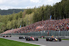 GP BELGIO, Sergio Perez (MEX) Red Bull Racing RB19 passes Charles Leclerc (MON) Ferrari SF-23 at the partenza of the race.
30.07.2023. Formula 1 World Championship, Rd 13, Belgian Grand Prix, Spa Francorchamps, Belgium, Gara Day.
 - www.xpbimages.com, EMail: requests@xpbimages.com © Copyright: Rew / XPB Images