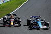 GP GIAPPONE, (L to R): Sergio Perez (MEX) Red Bull Racing RB19 e Esteban Ocon (FRA) Alpine F1 Team A523 battle for position.
24.09.2023. Formula 1 World Championship, Rd 17, Japanese Grand Prix, Suzuka, Japan, Gara Day.
 - www.xpbimages.com, EMail: requests@xpbimages.com © Copyright: Coates / XPB Images