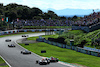 GP GIAPPONE, Sergio Perez (MEX) Red Bull Racing RB19 e Zhou Guanyu (CHN) Alfa Romeo F1 Team C43 battle for position.
24.09.2023. Formula 1 World Championship, Rd 17, Japanese Grand Prix, Suzuka, Japan, Gara Day.
 - www.xpbimages.com, EMail: requests@xpbimages.com © Copyright: Coates / XPB Images