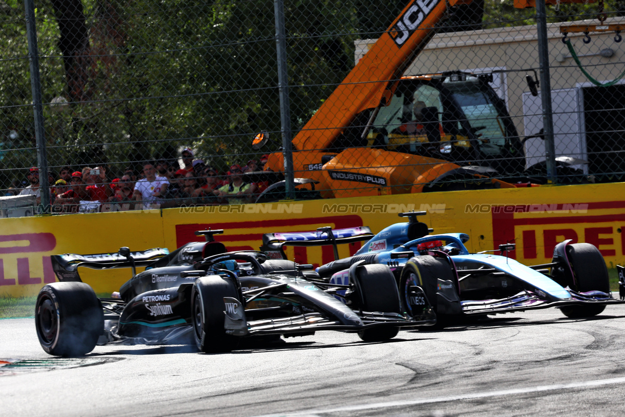 GP ITALIA, George Russell (GBR) Mercedes AMG F1 W14 leaves the pits ahead of Esteban Ocon (FRA) Alpine F1 Team A523 e runs wide.

03.09.2023. Formula 1 World Championship, Rd 15, Italian Grand Prix, Monza, Italy, Gara Day.

- www.xpbimages.com, EMail: requests@xpbimages.com © Copyright: Batchelor / XPB Images