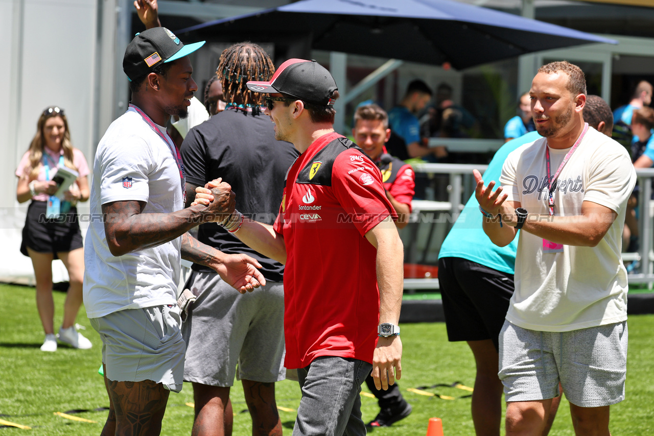 GP MIAMI, Charles Leclerc (MON) Ferrari with Miami Dolphins American Football Players.

04.05.2023. Formula 1 World Championship, Rd 5, Miami Grand Prix, Miami, Florida, USA, Preparation Day.

- www.xpbimages.com, EMail: requests@xpbimages.com ¬© Copyright: Moy / XPB Images