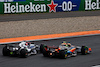 GP OLANDA, Liam Lawson (NZL) AlphaTauri AT04 e Lando Norris (GBR) McLaren MCL60 battle for position.
27.08.2023. Formula 1 World Championship, Rd 14, Dutch Grand Prix, Zandvoort, Netherlands, Gara Day.
 - www.xpbimages.com, EMail: requests@xpbimages.com © Copyright: Coates / XPB Images