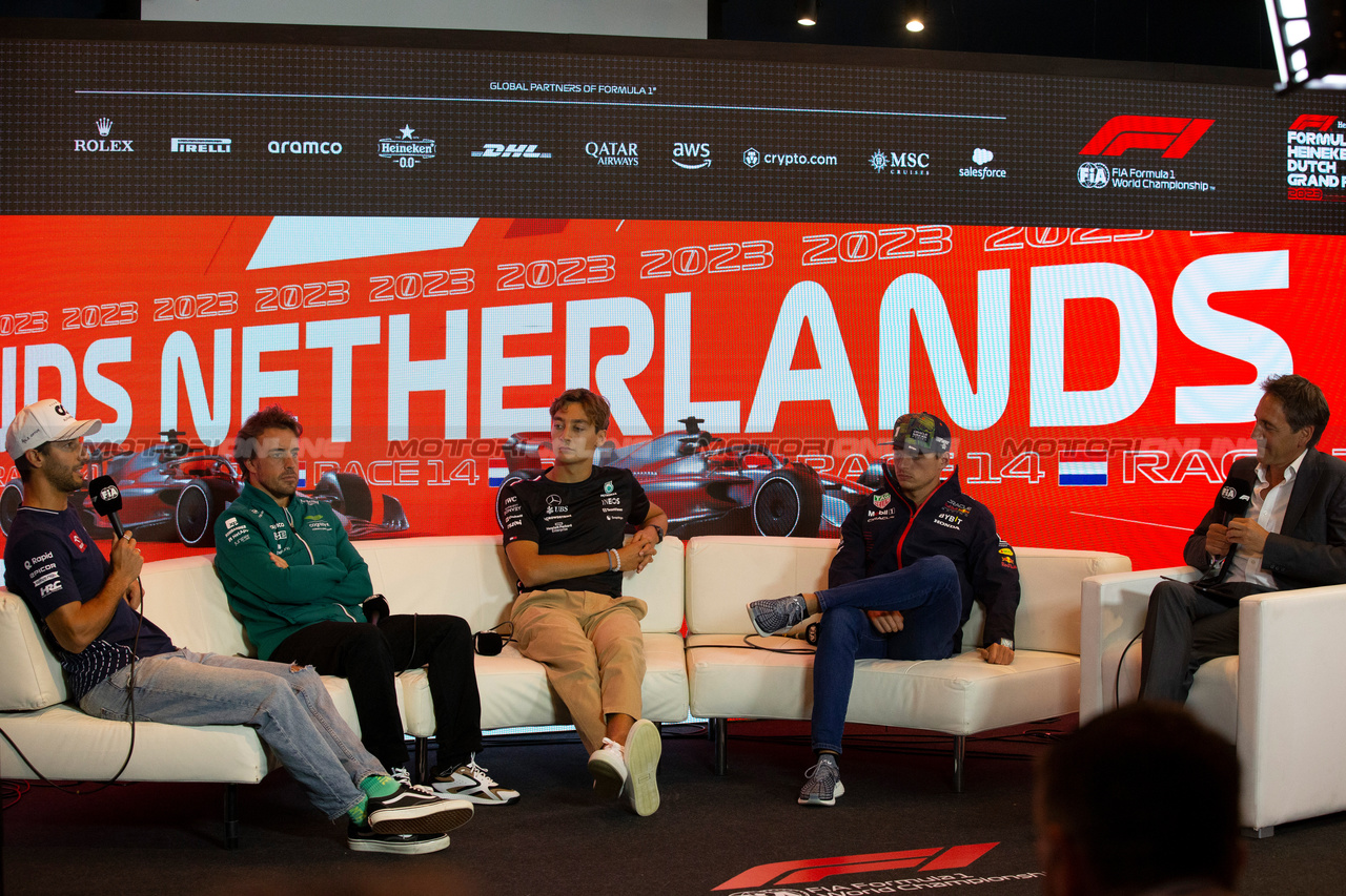 GP OLANDA, (L to R): Daniel Ricciardo (AUS) AlphaTauri; Fernando Alonso (ESP) Aston Martin F1 Team; George Russell (GBR) Mercedes AMG F1; e Max Verstappen (NLD) Red Bull Racing, in the FIA Press Conference.

24.08.2023. Formula 1 World Championship, Rd 14, Dutch Grand Prix, Zandvoort, Netherlands, Preparation Day.

- www.xpbimages.com, EMail: requests@xpbimages.com © Copyright: XPB Images