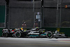 GP SINGAPORE, Lewis Hamilton (GBR) Mercedes AMG F1 W14 e Sergio Perez (MEX) Red Bull Racing RB19 battle for position.
17.09.2023. Formula 1 World Championship, Rd 16, Singapore Grand Prix, Marina Bay Street Circuit, Singapore, Gara Day.
- www.xpbimages.com, EMail: requests@xpbimages.com © Copyright: Moy / XPB Images