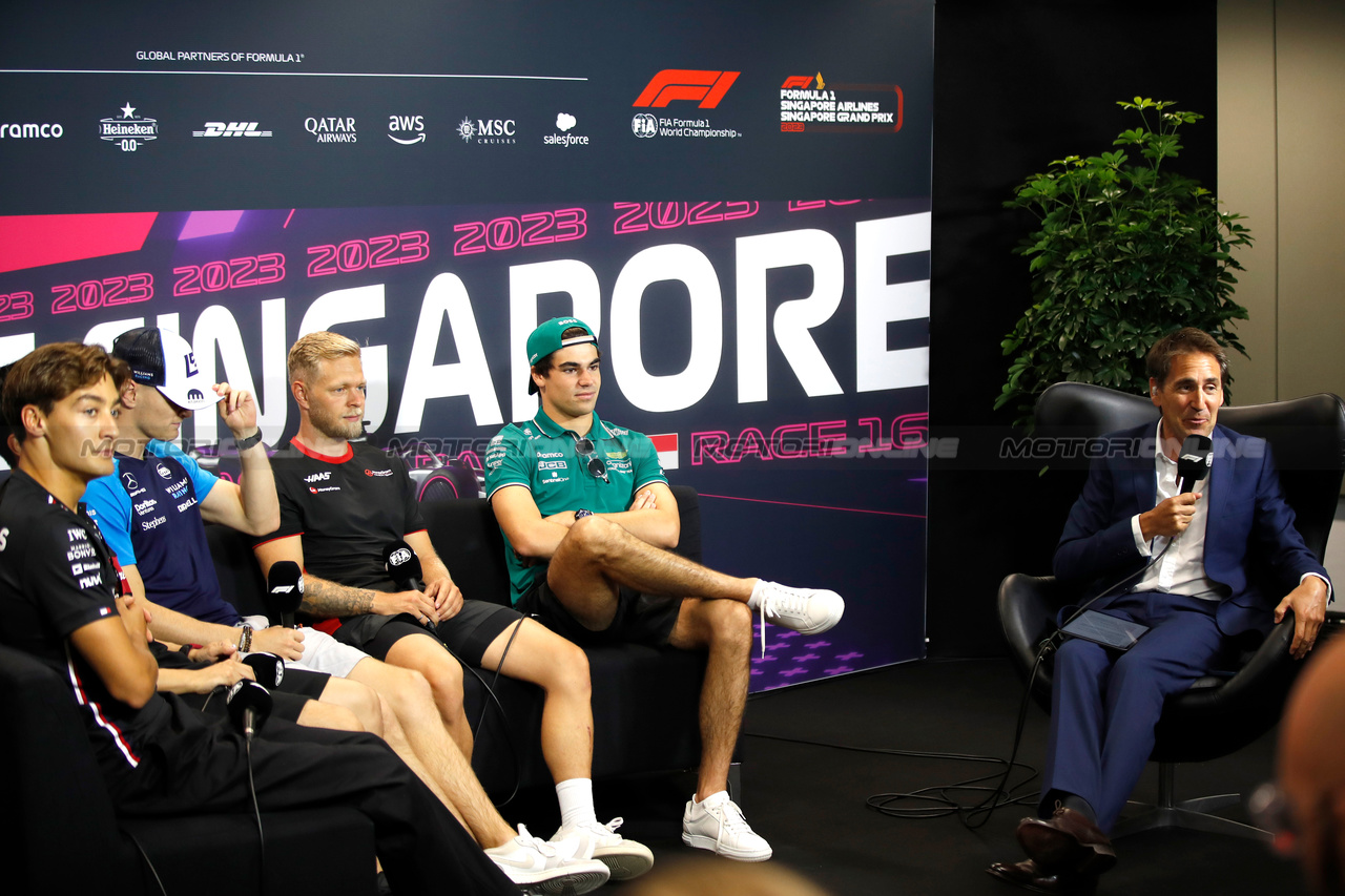 GP SINGAPORE, (L to R): George Russell (GBR) Mercedes AMG F1; Logan Sargeant (USA) Williams Racing; Kevin Magnussen (DEN) Haas F1 Team; Lance Stroll (CDN) Aston Martin F1 Team; e Tom Clarkson (GBR) Journalist, in the FIA Press Conference.

14.09.2023. Formula 1 World Championship, Rd 16, Singapore Grand Prix, Marina Bay Street Circuit, Singapore, Preparation Day.

- www.xpbimages.com, EMail: requests@xpbimages.com © Copyright: XPB Images