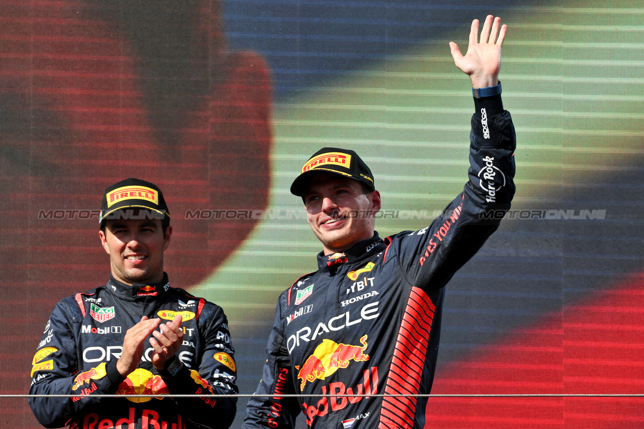 GP UNGHERIA, Gara winner Max Verstappen (NLD) Red Bull Racing celebrates on the podium with third placed team mate Sergio Perez (MEX) Red Bull Racing.

23.07.2023. Formula 1 World Championship, Rd 12, Hungarian Grand Prix, Budapest, Hungary, Gara Day.

- www.xpbimages.com, EMail: requests@xpbimages.com © Copyright: Moy / XPB Images