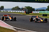 GP UNGHERIA, Oscar Piastri (AUS) McLaren MCL60 e Sergio Perez (MEX) Red Bull Racing RB19 battle for position.
23.07.2023. Formula 1 World Championship, Rd 12, Hungarian Grand Prix, Budapest, Hungary, Gara Day.
 - www.xpbimages.com, EMail: requests@xpbimages.com © Copyright: Coates / XPB Images