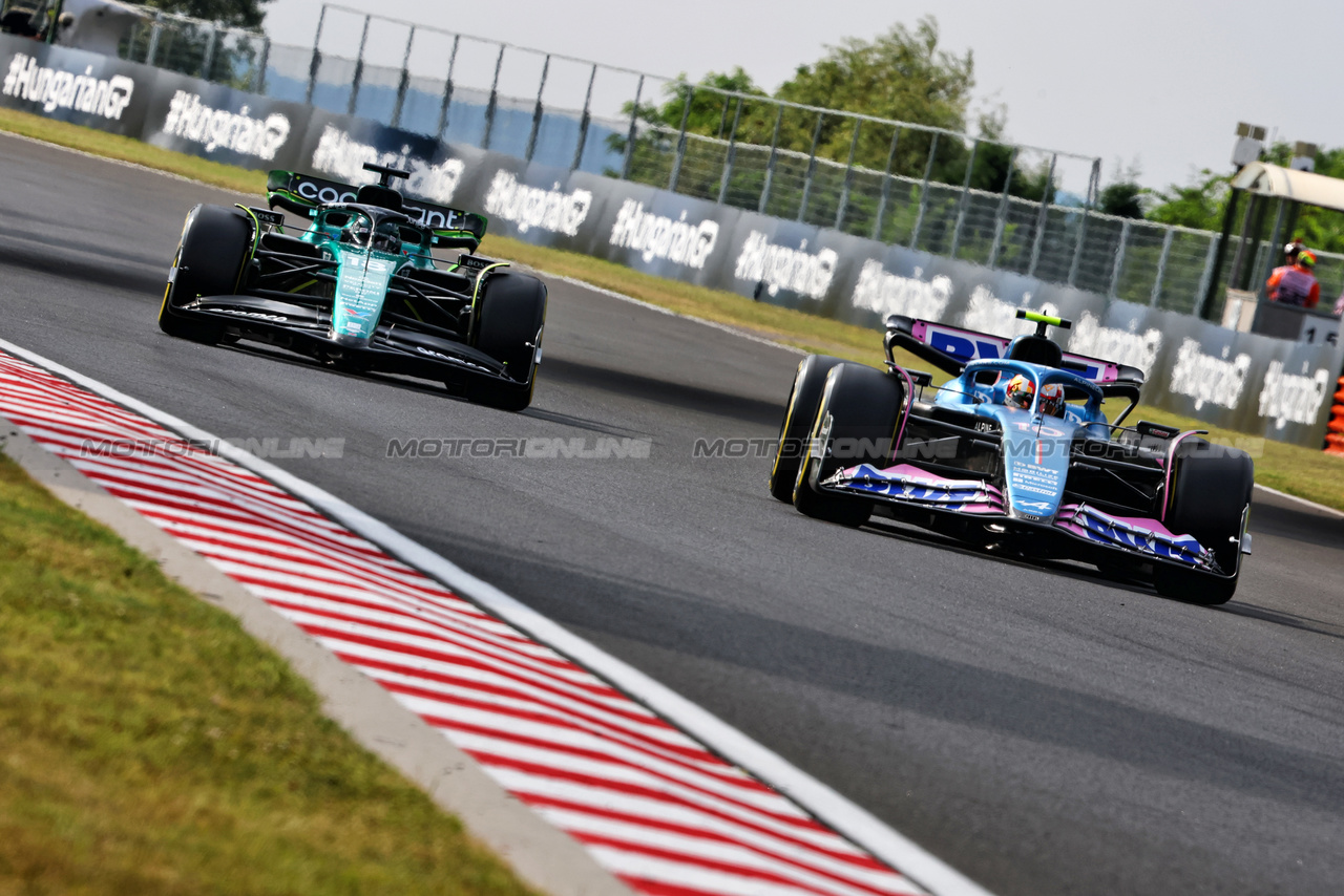 GP UNGHERIA, Pierre Gasly (FRA) Alpine F1 Team A523 e Lance Stroll (CDN) Aston Martin F1 Team AMR23.

21.07.2023. Formula 1 World Championship, Rd 12, Hungarian Grand Prix, Budapest, Hungary, Practice Day.

- www.xpbimages.com, EMail: requests@xpbimages.com © Copyright: Charniaux / XPB Images