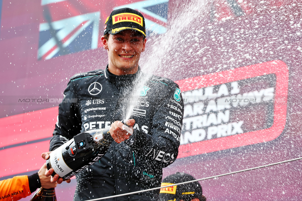 GP AUSTRIA, Gara winner George Russell (GBR) Mercedes AMG F1 celebrates on the podium.

30.06.2024. Formula 1 World Championship, Rd 11, Austrian Grand Prix, Spielberg, Austria, Gara Day.

 - www.xpbimages.com, EMail: requests@xpbimages.com © Copyright: Coates / XPB Images