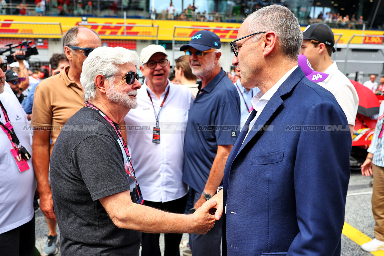 GP AUSTRIA, (L to R): George Lucas (USA) Star Wars Creator on the grid with Stefano Domenicali (ITA) Formula One President e CEO.

30.06.2024. Formula 1 World Championship, Rd 11, Austrian Grand Prix, Spielberg, Austria, Gara Day.

- www.xpbimages.com, EMail: requests@xpbimages.com © Copyright: Batchelor / XPB Images