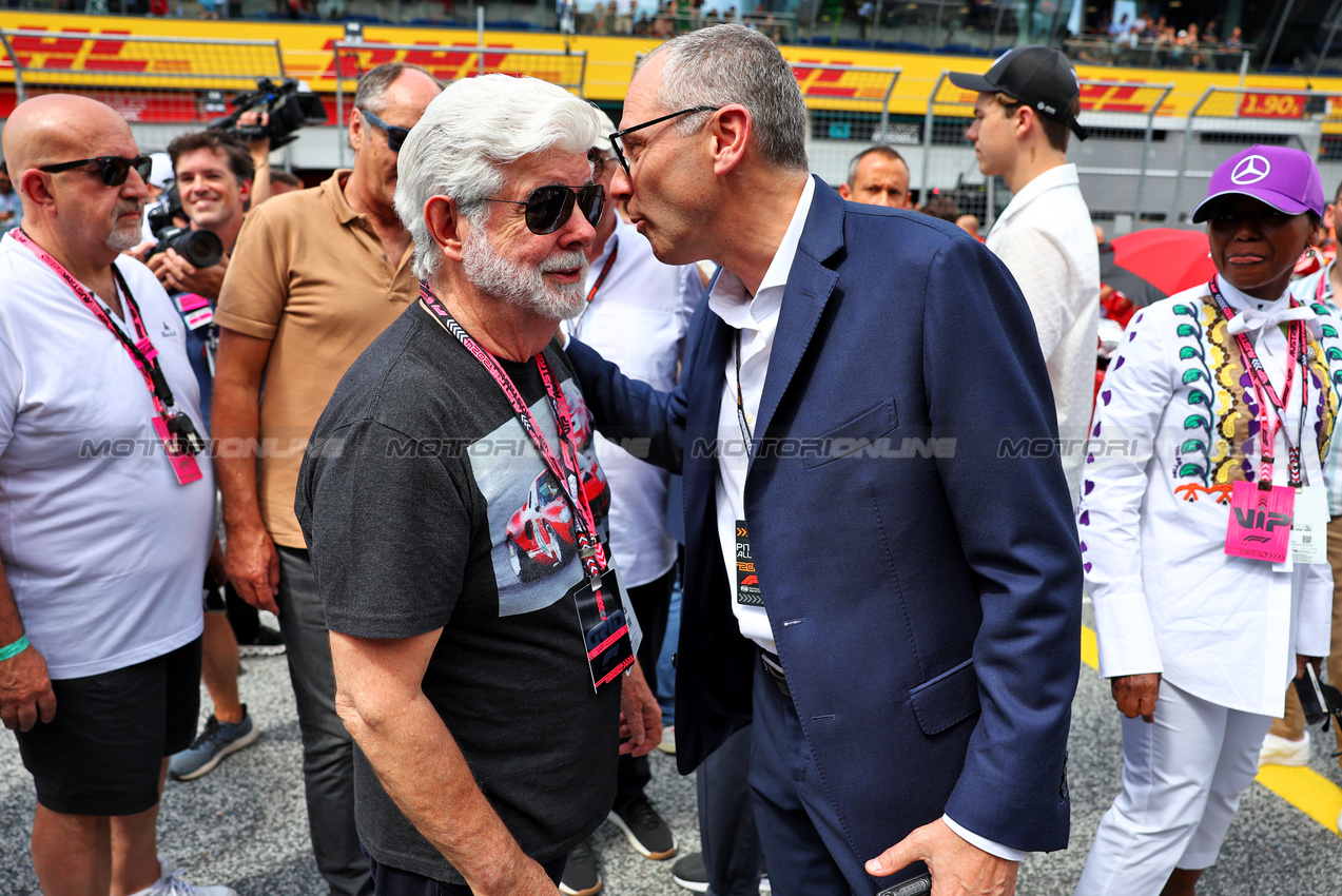 GP AUSTRIA, (L to R): George Lucas (USA) Star Wars Creator on the grid with Stefano Domenicali (ITA) Formula One President e CEO.

30.06.2024. Formula 1 World Championship, Rd 11, Austrian Grand Prix, Spielberg, Austria, Gara Day.

- www.xpbimages.com, EMail: requests@xpbimages.com © Copyright: Batchelor / XPB Images