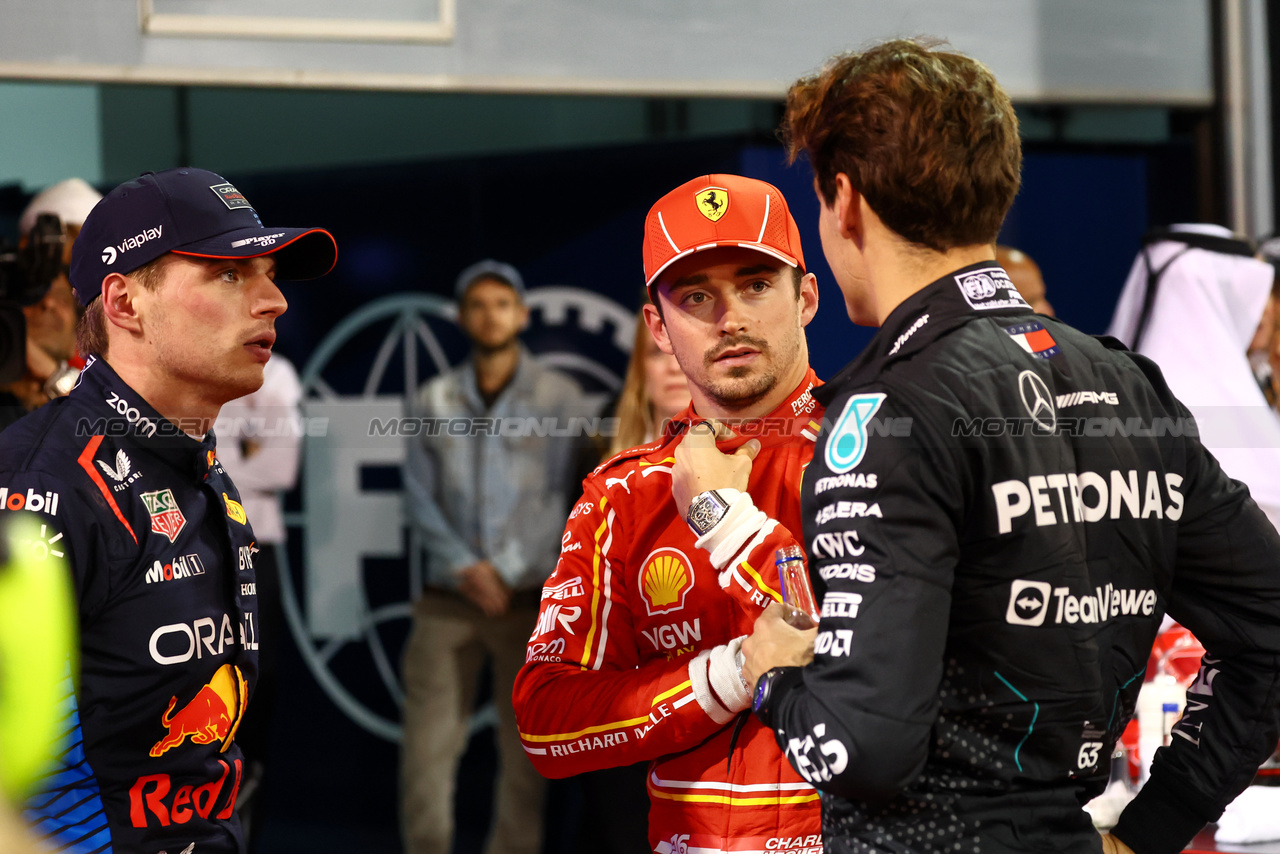 GP BAHRAIN, (L to R): pole sitter Max Verstappen (NLD) Red Bull Racing with Charles Leclerc (MON) Ferrari e George Russell (GBR) Mercedes AMG F1 in qualifying parc ferme.

01.03.2024. Formula 1 World Championship, Rd 1, Bahrain Grand Prix, Sakhir, Bahrain, Qualifiche Day.

- www.xpbimages.com, EMail: requests@xpbimages.com © Copyright: Batchelor / XPB Images