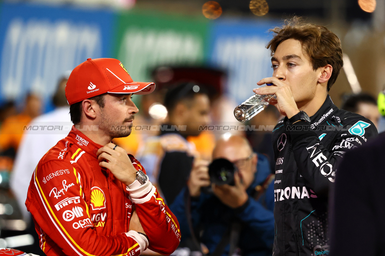 GP BAHRAIN, (L to R): Charles Leclerc (MON) Ferrari with George Russell (GBR) Mercedes AMG F1 in qualifying parc ferme.

01.03.2024. Formula 1 World Championship, Rd 1, Bahrain Grand Prix, Sakhir, Bahrain, Qualifiche Day.

- www.xpbimages.com, EMail: requests@xpbimages.com © Copyright: Charniaux / XPB Images