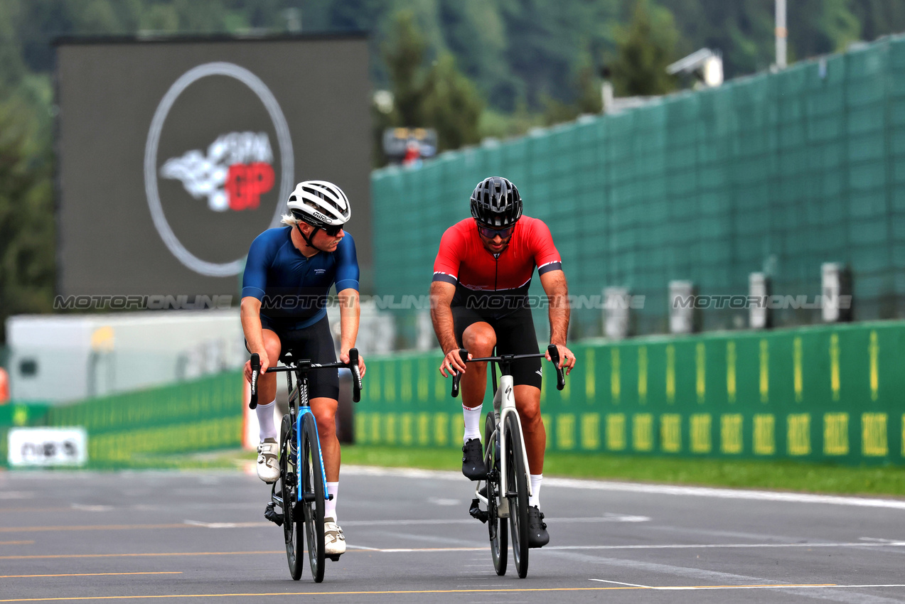 GP BELGIO, (L to R): Valtteri Bottas (FIN) Sauber rides the circuit with Carlos Sainz Jr (ESP) Ferrari.

25.07.2024. Formula 1 World Championship, Rd 14, Belgian Grand Prix, Spa Francorchamps, Belgium, Preparation Day.

- www.xpbimages.com, EMail: requests@xpbimages.com © Copyright: Rew / XPB Images