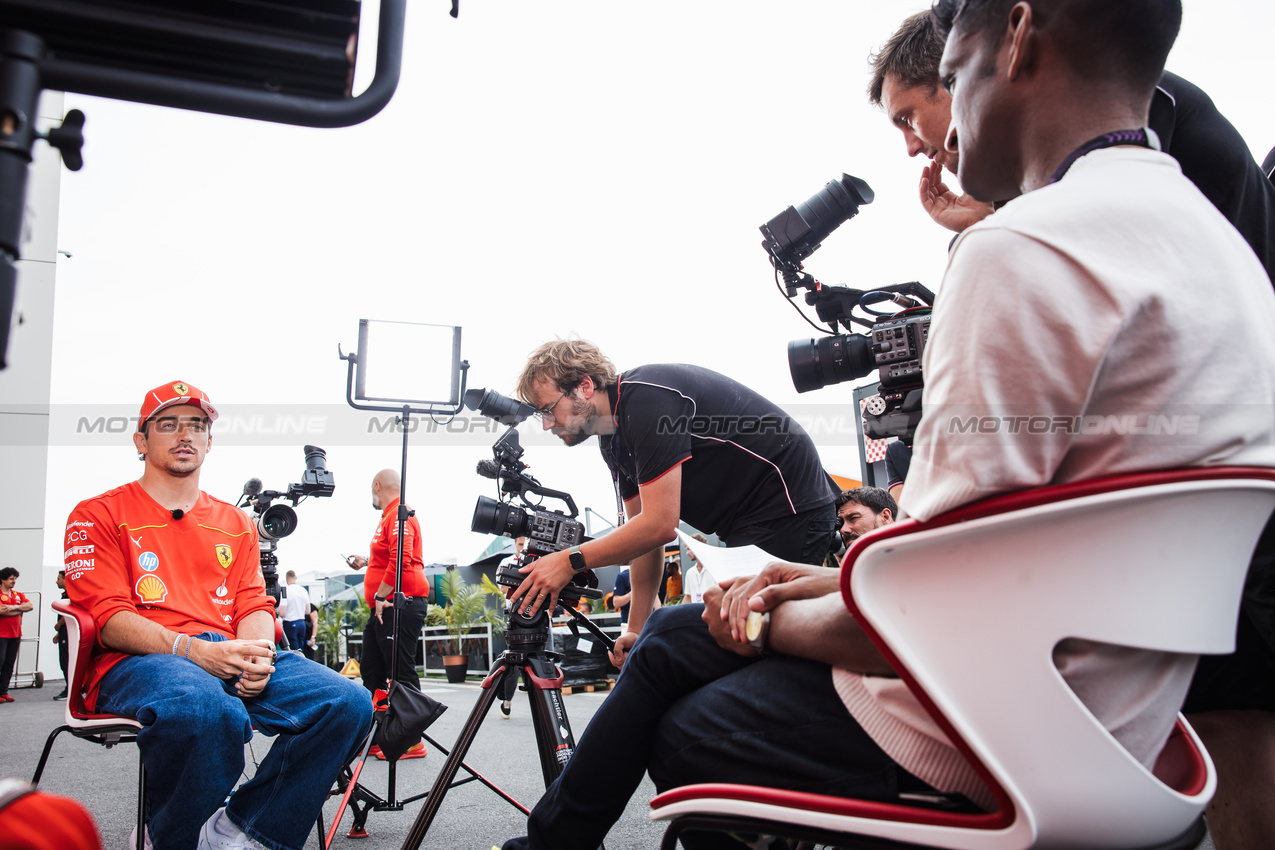 GP CANADA, Charles Leclerc (MON) Ferrari with Lawrence Barretto (GBR) Formula 1 Senior Writer Editor.

06.06.2024. Formula 1 World Championship, Rd 9, Canadian Grand Prix, Montreal, Canada, Preparation Day.

- www.xpbimages.com, EMail: requests@xpbimages.com © Copyright: Bearne / XPB Images