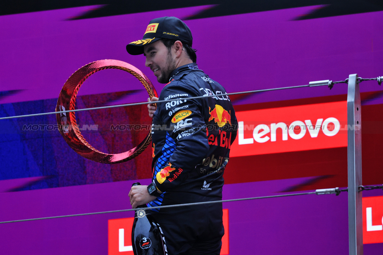 GP CINA, Sergio Perez (MEX) Red Bull Racing celebrates his third position on the podium.

21.04.2024. Formula 1 World Championship, Rd 5, Chinese Grand Prix, Shanghai, China, Gara Day.

- www.xpbimages.com, EMail: requests@xpbimages.com © Copyright: Rew / XPB Images