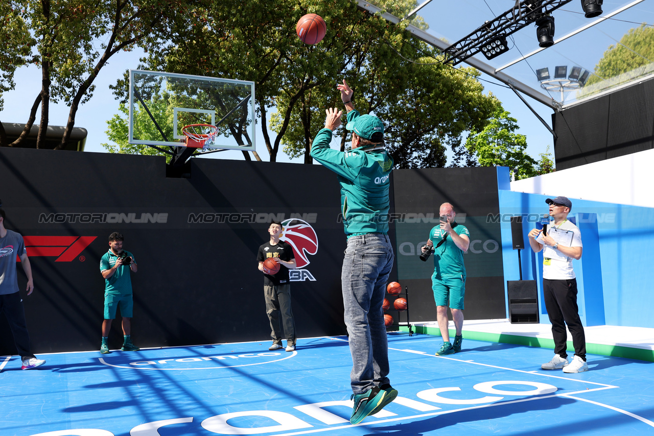 GP CINA, Fernando Alonso (ESP) Aston Martin F1 Team plays basketball in the paddock.

18.04.2024. Formula 1 World Championship, Rd 5, Chinese Grand Prix, Shanghai, China, Preparation Day.

- www.xpbimages.com, EMail: requests@xpbimages.com © Copyright: Rew / XPB Images