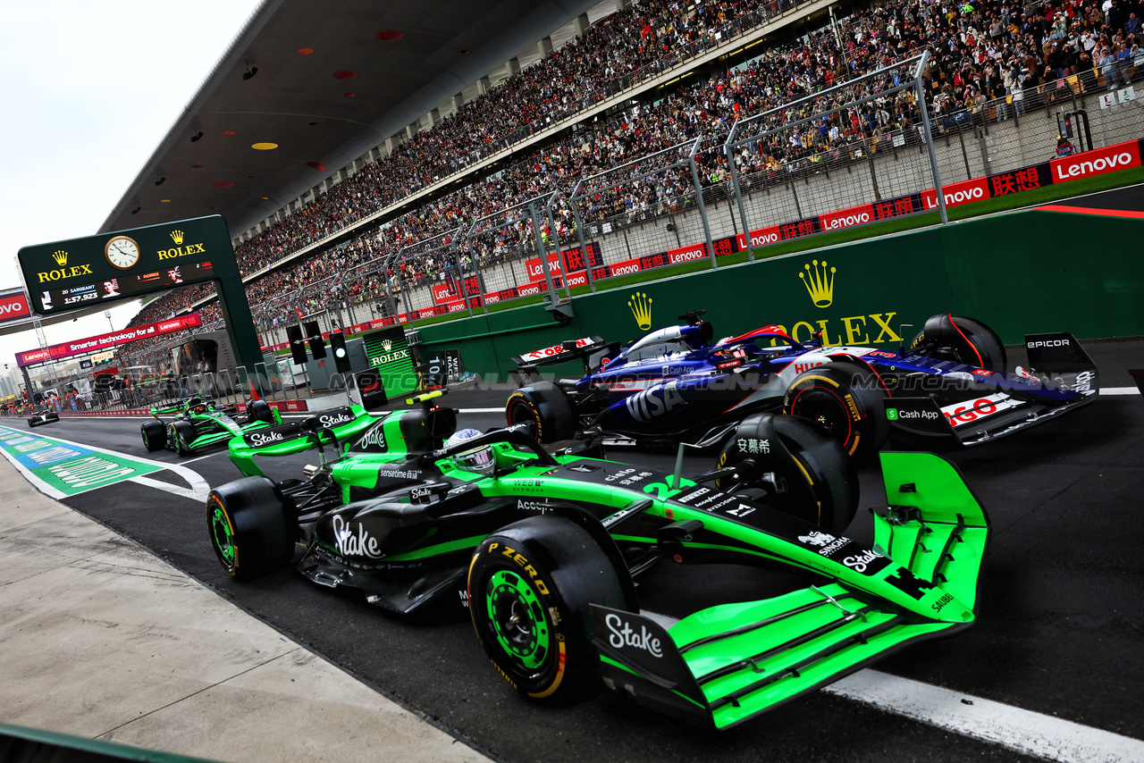 GP CINA, Zhou Guanyu (CHN) Sauber C44 e Daniel Ricciardo (AUS) RB VCARB 01 leave the pits.

19.04.2024. Formula 1 World Championship, Rd 5, Chinese Grand Prix, Shanghai, China, Sprint Qualifiche Day.

- www.xpbimages.com, EMail: requests@xpbimages.com © Copyright: Batchelor / XPB Images