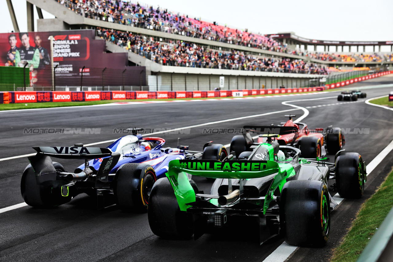 GP CINA, Zhou Guanyu (CHN) Sauber C44 e Daniel Ricciardo (AUS) RB VCARB 01 leave the pits.

19.04.2024. Formula 1 World Championship, Rd 5, Chinese Grand Prix, Shanghai, China, Sprint Qualifiche Day.

- www.xpbimages.com, EMail: requests@xpbimages.com © Copyright: Batchelor / XPB Images