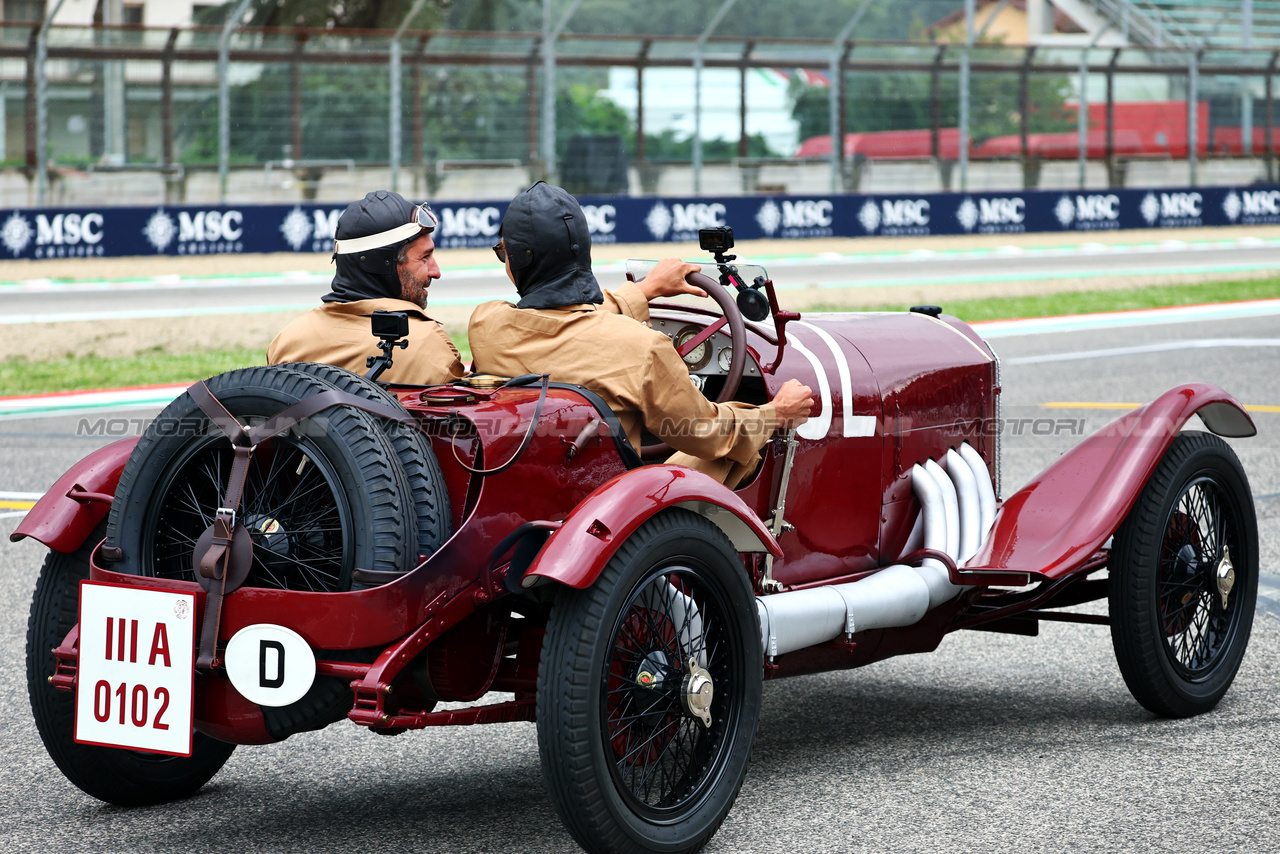 GP IMOLA, George Russell (GBR) Mercedes AMG F1 e Timo Glock (GER) in vintage race overalls in a 1924 Targa Florio Mercedes racing car.

16.05.2024. Formula 1 World Championship, Rd 7, Emilia Romagna Grand Prix, Imola, Italy, Preparation Day.

- www.xpbimages.com, EMail: requests@xpbimages.com © Copyright: Batchelor / XPB Images