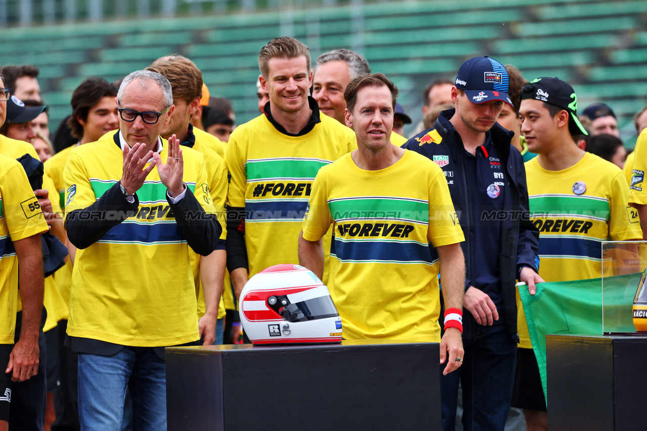 GP IMOLA, (L to R): Stefano Domenicali (ITA) Formula One President e CEO; Sebastian Vettel (GER) - Drivers e team personnel - tribute run for Ayrton Senna e Roland Ratzenberger.

16.05.2024. Formula 1 World Championship, Rd 7, Emilia Romagna Grand Prix, Imola, Italy, Preparation Day.

- www.xpbimages.com, EMail: requests@xpbimages.com © Copyright: Batchelor / XPB Images