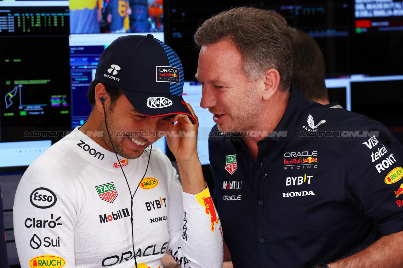 GP IMOLA, (L to R): Sergio Perez (MEX) Red Bull Racing with Christian Horner (GBR) Red Bull Racing Team Principal.

18.05.2024. Formula 1 World Championship, Rd 7, Emilia Romagna Grand Prix, Imola, Italy, Qualifiche Day.

 - www.xpbimages.com, EMail: requests@xpbimages.com © Copyright: Coates / XPB Images