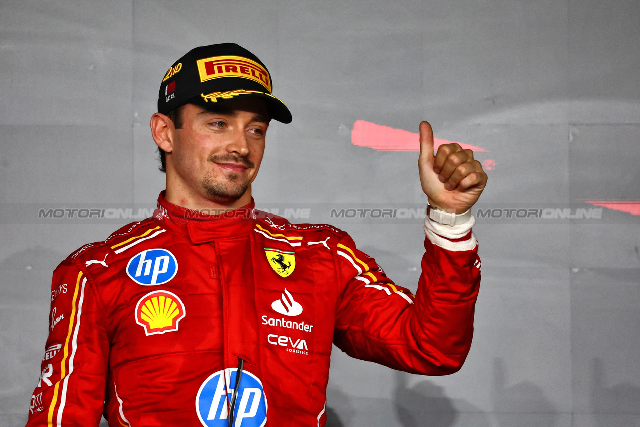 GP QATAR, Charles Leclerc (MON) Ferrari celebrates his second position on the podium.

01.12.2024. Formula 1 World Championship, Rd 23, Qatar Grand Prix, Doha, Qatar, Gara Day.

- www.xpbimages.com, EMail: requests@xpbimages.com © Copyright: Charniaux / XPB Images
