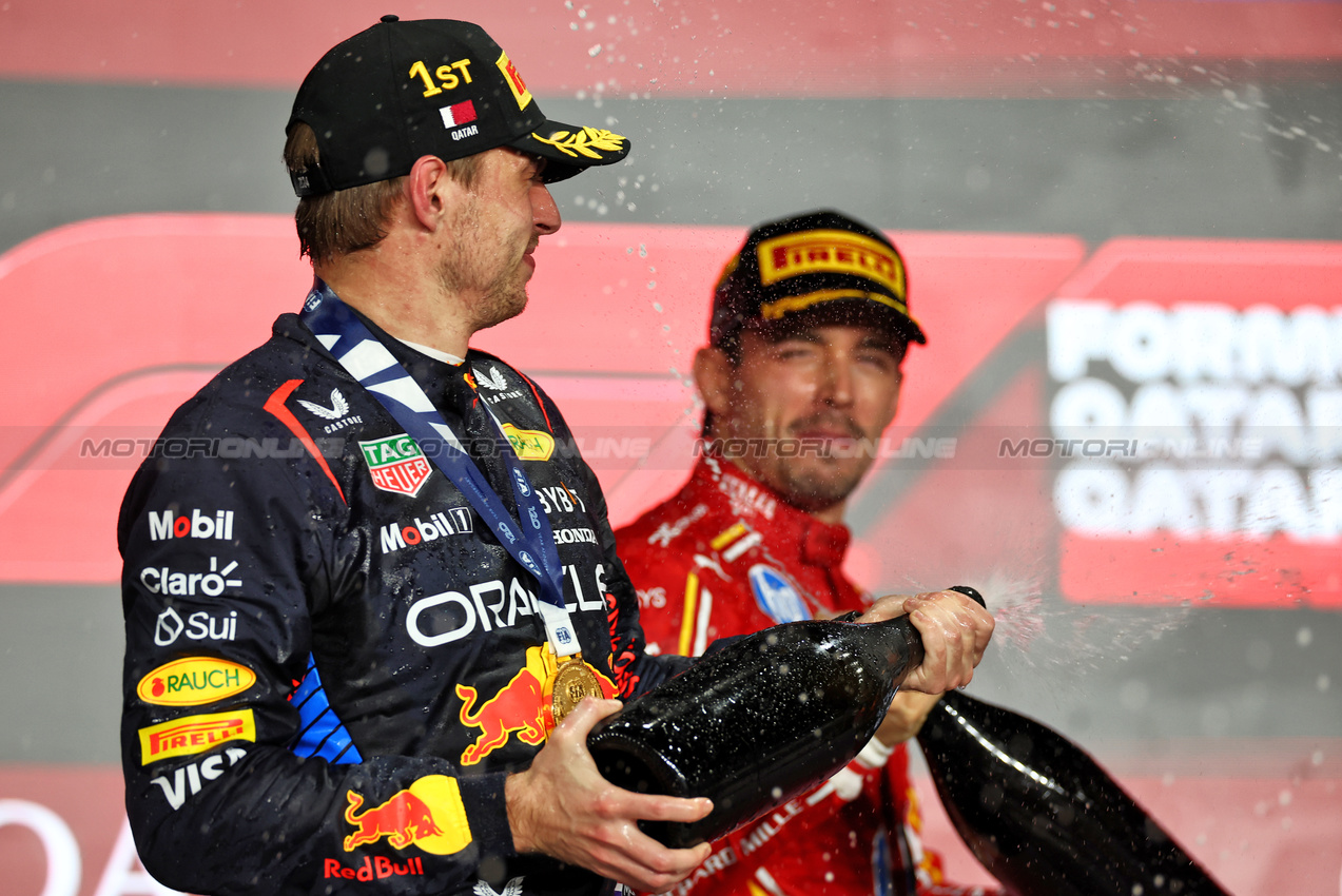 GP QATAR, Gara winner Max Verstappen (NLD) Red Bull Racing celebrates on the podium.

01.12.2024. Formula 1 World Championship, Rd 23, Qatar Grand Prix, Doha, Qatar, Gara Day.

 - www.xpbimages.com, EMail: requests@xpbimages.com © Copyright: Staley / XPB Images