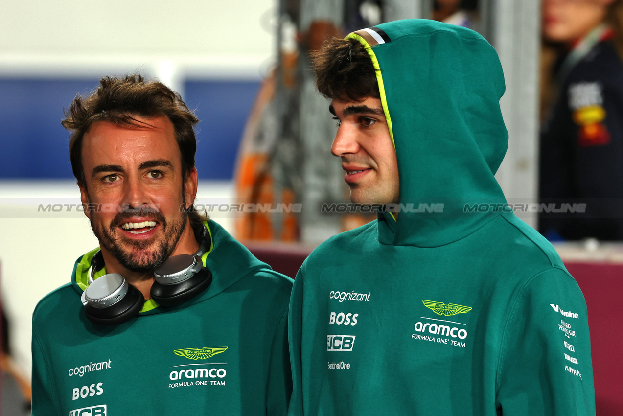 GP QATAR, (L to R): Fernando Alonso (ESP) Aston Martin F1 Team with team mate Lance Stroll (CDN) Aston Martin F1 Team on the drivers' parade.

01.12.2024. Formula 1 World Championship, Rd 23, Qatar Grand Prix, Doha, Qatar, Gara Day.

 - www.xpbimages.com, EMail: requests@xpbimages.com © Copyright: Coates / XPB Images