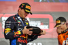 GP QATAR, Gara winner Max Verstappen (NLD) Red Bull Racing celebrates on the podium.

01.12.2024. Formula 1 World Championship, Rd 23, Qatar Grand Prix, Doha, Qatar, Gara Day.

 - www.xpbimages.com, EMail: requests@xpbimages.com © Copyright: Staley / XPB Images