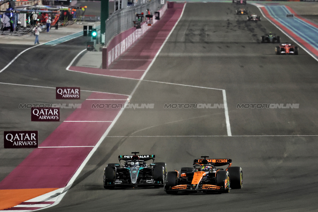 GP QATAR, George Russell (GBR) Mercedes AMG F1 W15 e Oscar Piastri (AUS) McLaren MCL38 battle for position.

30.11.2024. Formula 1 World Championship, Rd 23, Qatar Grand Prix, Doha, Qatar, Sprint e Qualifiche Day.

- www.xpbimages.com, EMail: requests@xpbimages.com © Copyright: Moy / XPB Images