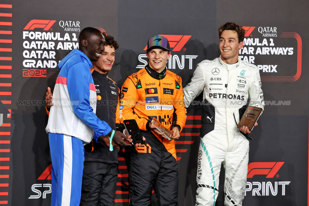 GP QATAR, Sprint top three in parc ferme (L to R): Khaby Lame (SEN); Lando Norris (GBR) McLaren, second; Oscar Piastri (AUS) McLaren, winner; George Russell (GBR) Mercedes AMG F1, third.

30.11.2024. Formula 1 World Championship, Rd 23, Qatar Grand Prix, Doha, Qatar, Sprint e Qualifiche Day.

- www.xpbimages.com, EMail: requests@xpbimages.com © Copyright: Moy / XPB Images
