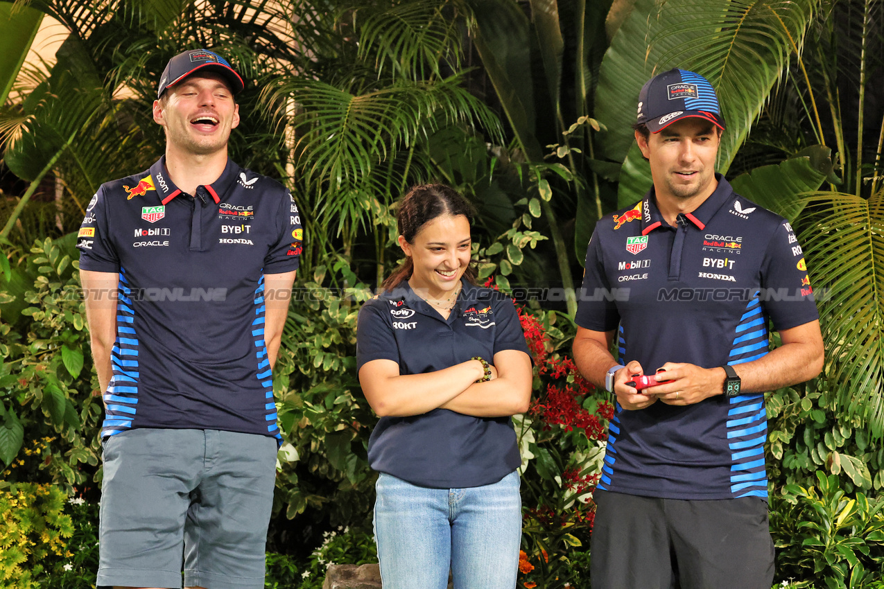GP SINGAPORE, (L to R): Max Verstappen (NLD) Red Bull Racing with Hamda Al Qubaisi (UAE) MP Motorsport F1 Academy Driver; e Sergio Perez (MEX) Red Bull Racing.

19.09.2024. Formula 1 World Championship, Rd 18, Singapore Grand Prix, Marina Bay Street Circuit, Singapore, Preparation Day.

- www.xpbimages.com, EMail: requests@xpbimages.com © Copyright: Rew / XPB Images
