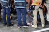 GP SINGAPORE, Circuit Atmosfera - Niels Wittich (GER) FIA F1 Gara Director oversees a manhole cover repair.

20.09.2024. Formula 1 World Championship, Rd 18, Singapore Grand Prix, Marina Bay Street Circuit, Singapore, Practice Day.

- www.xpbimages.com, EMail: requests@xpbimages.com © Copyright: Rew / XPB Images