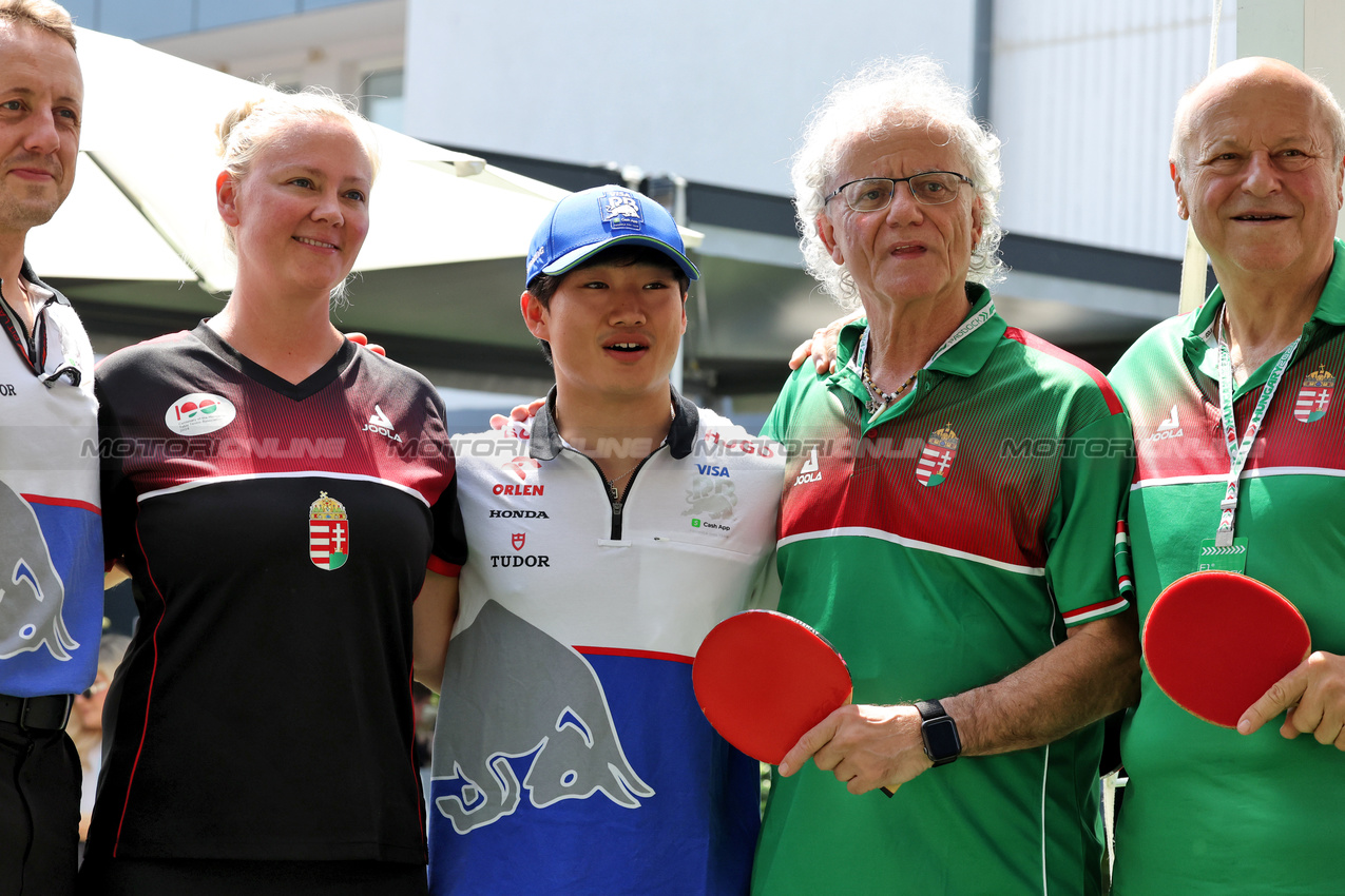 GP UNGHERIA, Yuki Tsunoda (JPN) RB with table tennis players.

19.07.2024. Formula 1 World Championship, Rd 13, Hungarian Grand Prix, Budapest, Hungary, Practice Day.

- www.xpbimages.com, EMail: requests@xpbimages.com © Copyright: Bearne / XPB Images