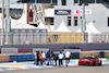 TEST BAHRAIN, Circuit workers inspect the circuit for a damaged drain cover at turn 11.
22.02.2024. Formula 1 Testing, Sakhir, Bahrain, Day Two.
- www.xpbimages.com, EMail: requests@xpbimages.com © Copyright: Bearne / XPB Images