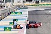 TEST BAHRAIN, Circuit workers inspect the circuit for a damaged drain cover at turn 11.
22.02.2024. Formula 1 Testing, Sakhir, Bahrain, Day Two.
- www.xpbimages.com, EMail: requests@xpbimages.com © Copyright: Bearne / XPB Images