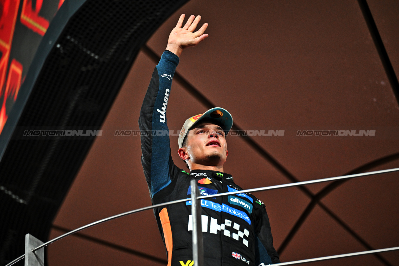 GP ABU DHABI, Third placed World Champion Lando Norris (GBR) McLaren celebrates on the podium.

07.12.2025. Formula 1 World Championship, Rd 24, Abu Dhabi Grand Prix, Yas Marina Circuit, Abu Dhabi, Gara Day.

- www.xpbimages.com, EMail: requests@xpbimages.com © Copyright: Price / XPB Images